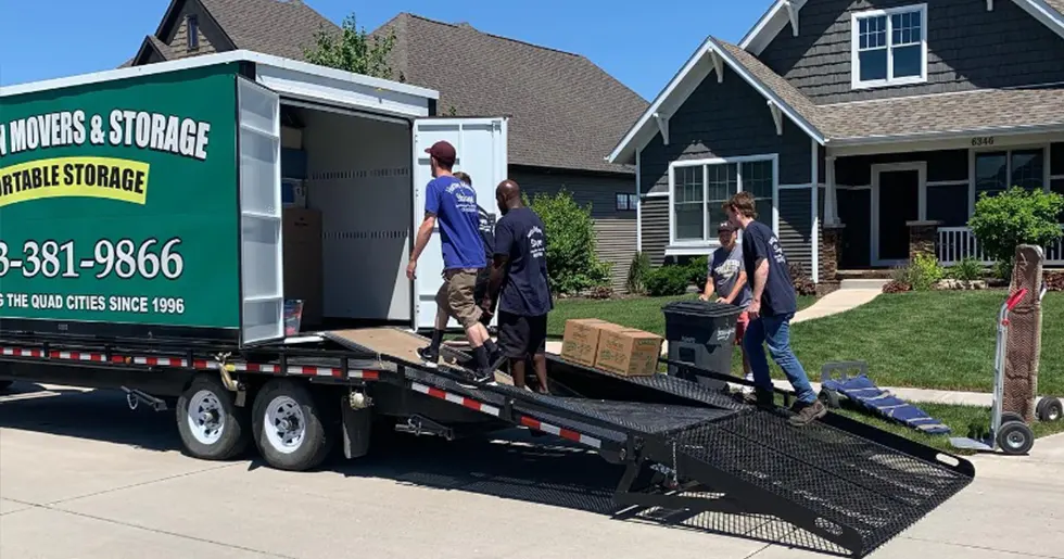 Movers Carrying Shelving Unit Comprehensive Moving Services